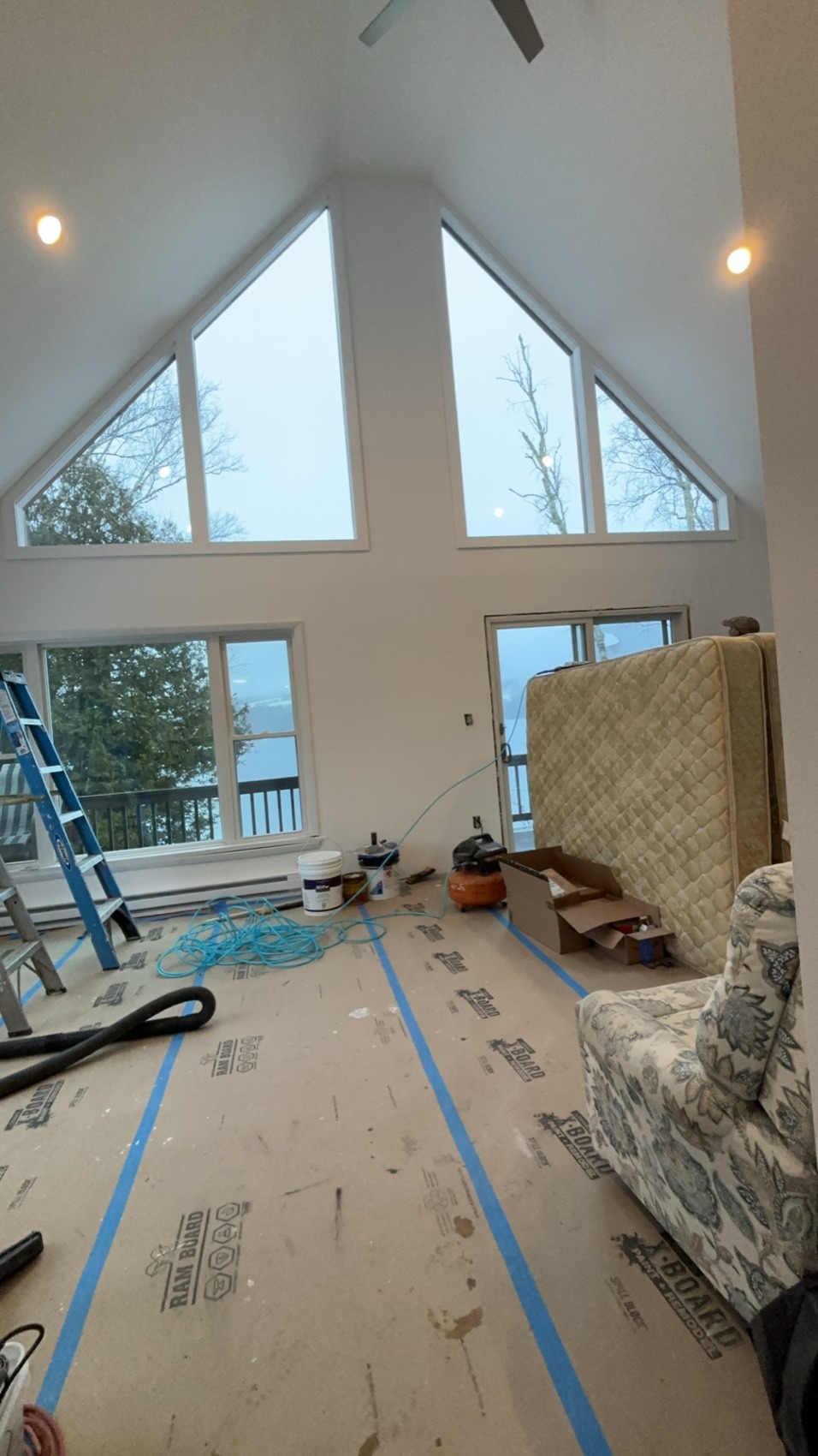 Great room with tall windows during an interior renovation